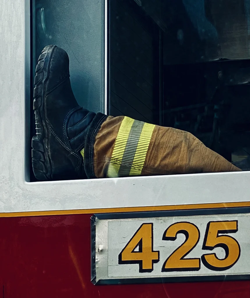 Firefighter's boot resting in vehicle