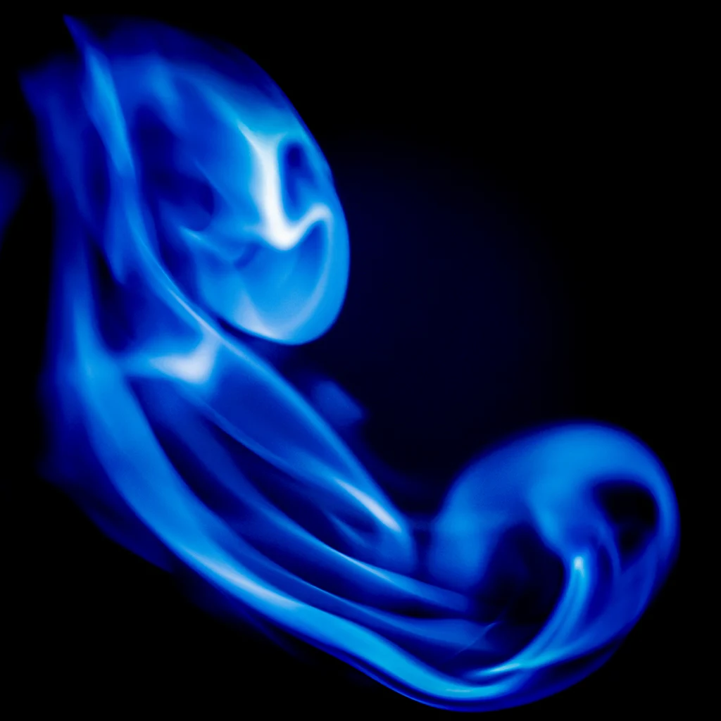 Abstract blue smoke on black